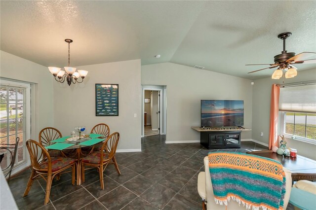 3175 Lakatos St, North Port, FL 34286 - dining area featuring lofted ceiling, ceiling fan with notable chandelier, dark tile patterned flooring, and baseboards