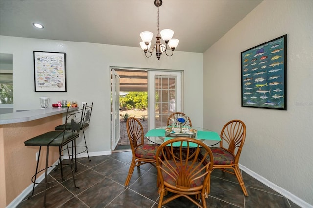 3175 Lakatos St, North Port, FL 34286 - dining area featuring an inviting chandelier, a healthy amount of sunlight, dark tile patterned flooring, and baseboards