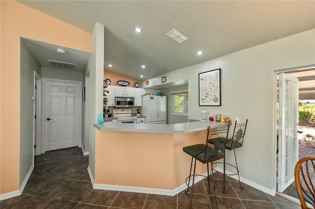 3175 Lakatos St, North Port, FL 34286 - kitchen with visible vents, white appliances, and a healthy amount of sunlight