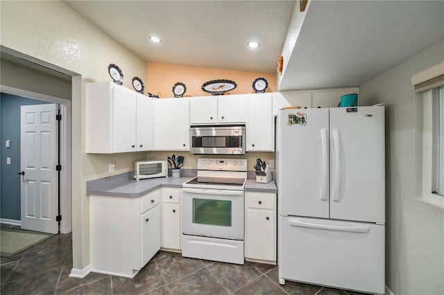 3175 Lakatos St, North Port, FL 34286 - kitchen featuring recessed lighting, a toaster, white cabinetry, and white appliances