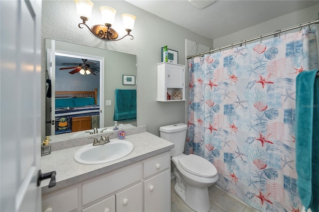 3175 Lakatos St, North Port, FL 34286 - bathroom featuring tile patterned flooring, a textured wall, a ceiling fan, vanity, and toilet