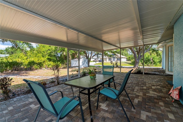 3175 Lakatos St, North Port, FL 34286 - view of patio featuring a storage shed, outdoor dining space, and an outbuilding