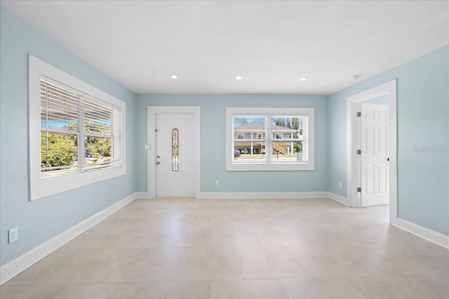 entryway featuring recessed lighting and baseboards
