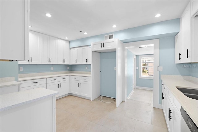 kitchen with recessed lighting, dishwasher, visible vents, light tile patterned floors, and white cabinetry