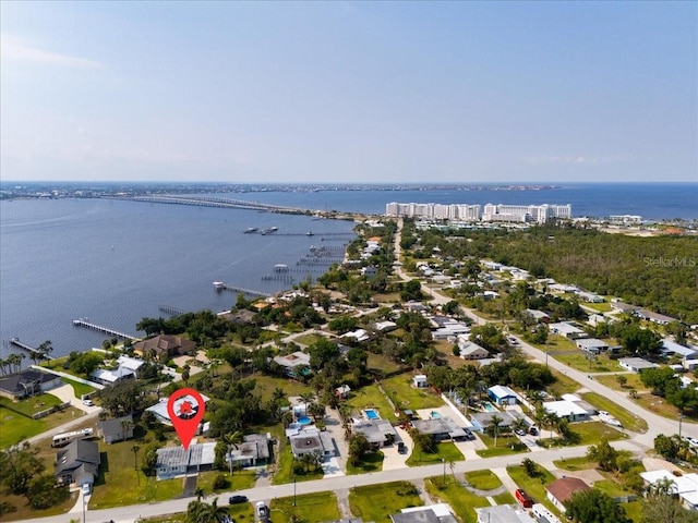 drone / aerial view with a residential view and a water view