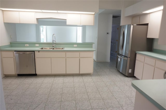 29211 Picador St, Punta Gorda, FL 33982 - kitchen featuring stainless steel appliances, a sink, light countertops, and a peninsula