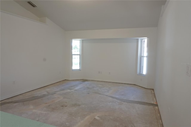 29211 Picador St, Punta Gorda, FL 33982 - spare room with baseboards, lofted ceiling, and concrete flooring