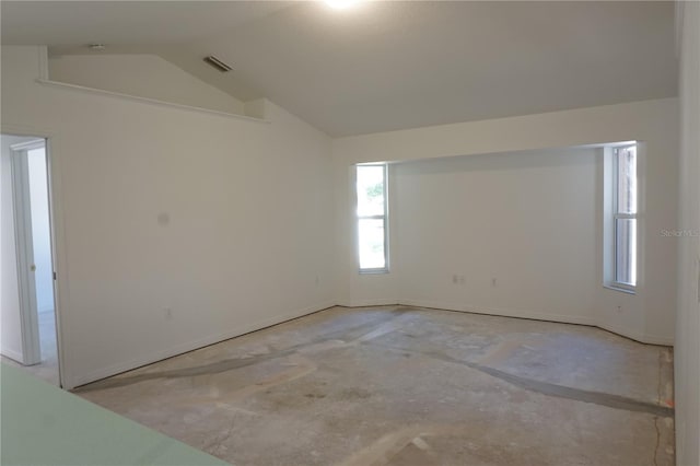 29211 Picador St, Punta Gorda, FL 33982 - spare room featuring vaulted ceiling, healthy amount of natural light, and baseboards
