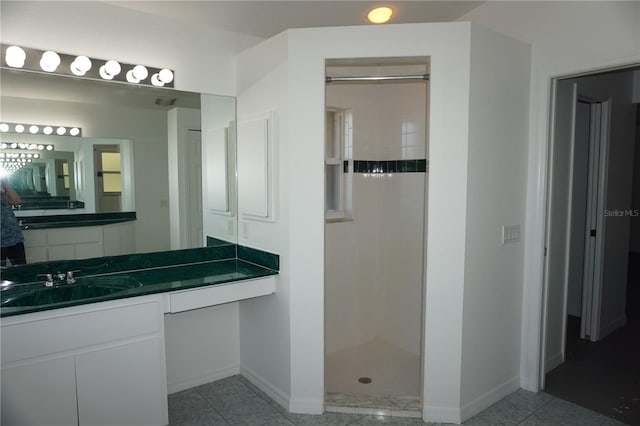 29211 Picador St, Punta Gorda, FL 33982 - bathroom with walk in shower, vanity, baseboards, and tile patterned flooring