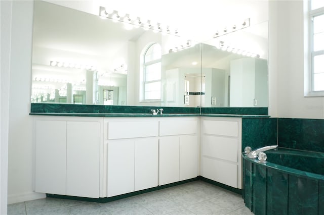 29211 Picador St, Punta Gorda, FL 33982 - full bath with plenty of natural light, a garden tub, vanity, and tile patterned floors