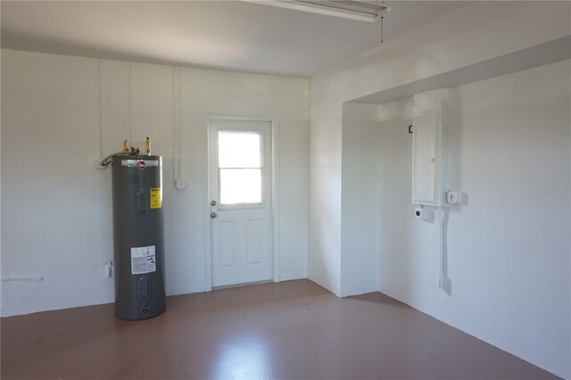 29211 Picador St, Punta Gorda, FL 33982 - foyer with electric water heater, electric panel, and finished concrete flooring