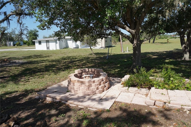 29211 Picador St, Punta Gorda, FL 33982 - view of grassy yard with a fire pit