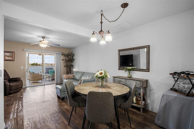26290 Rampart Blvd Unit D, Punta Gorda, FL 33983 - dining area with dark wood finished floors, a chandelier, and ceiling fan