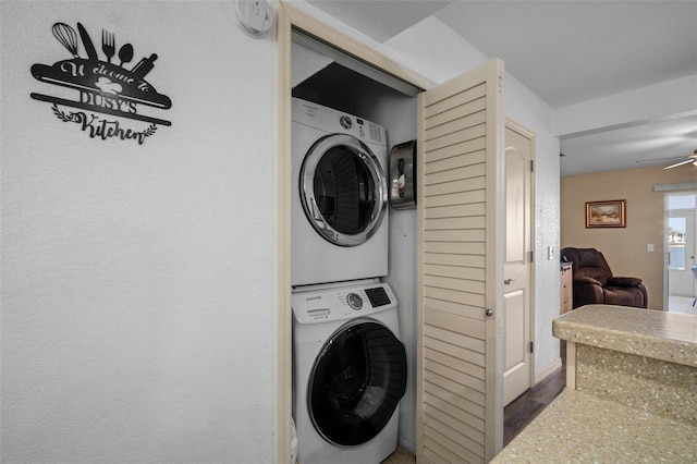 26290 Rampart Blvd Unit D, Punta Gorda, FL 33983 - laundry area featuring stacked washer / drying machine and a ceiling fan
