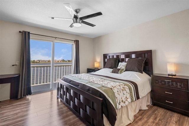 26290 Rampart Blvd Unit D, Punta Gorda, FL 33983 - bedroom with access to exterior, wood finished floors, and ceiling fan