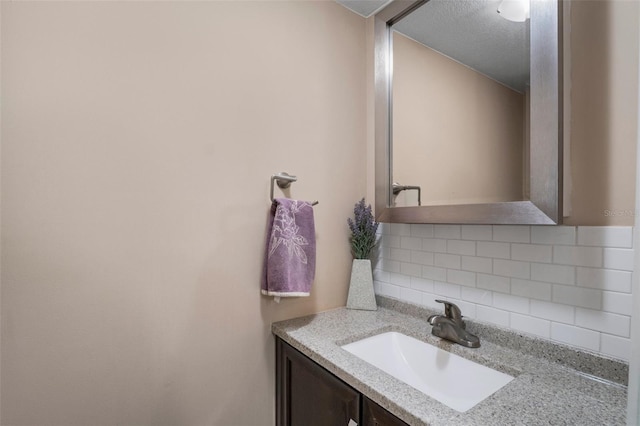 26290 Rampart Blvd Unit D, Punta Gorda, FL 33983 - bathroom with backsplash and vanity