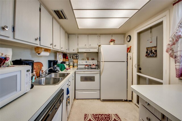 1432 Tropic Ter Unit 1432, North Fort Myers, FL 33903 - kitchen featuring white appliances, a sink, under cabinet range hood, and light countertops