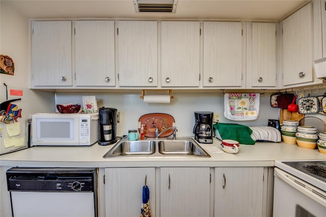 1432 Tropic Ter Unit 1432, North Fort Myers, FL 33903 - kitchen with white appliances, a sink, and light countertops