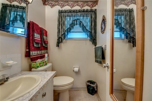 1432 Tropic Ter Unit 1432, North Fort Myers, FL 33903 - bathroom with toilet, plenty of natural light, and vanity