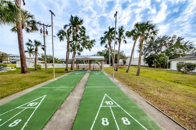 1432 Tropic Ter Unit 1432, North Fort Myers, FL 33903 - surrounding community with a lawn and shuffleboard