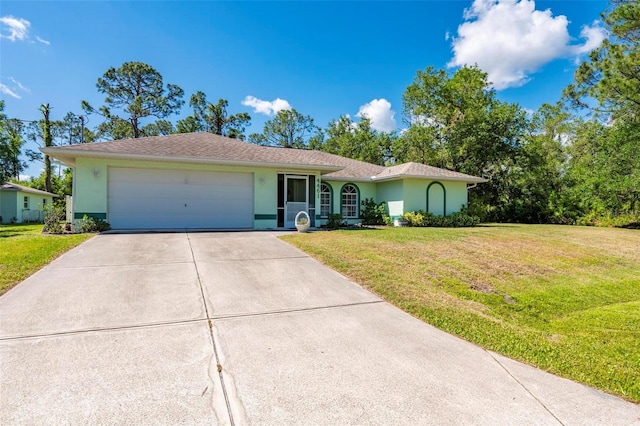 4461 La France Ave, North Port, FL 34286 - ranch-style home with concrete driveway, stucco siding, and an attached garage