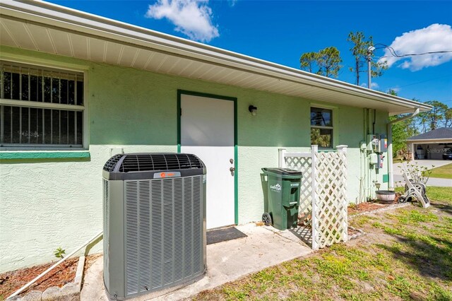 4461 La France Ave, North Port, FL 34286 - entrance to property with central AC and stucco siding