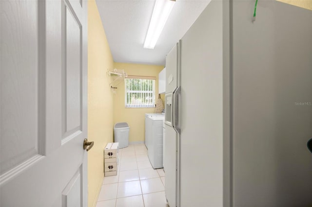 4461 La France Ave, North Port, FL 34286 - laundry area with separate washer and dryer and light tile patterned flooring