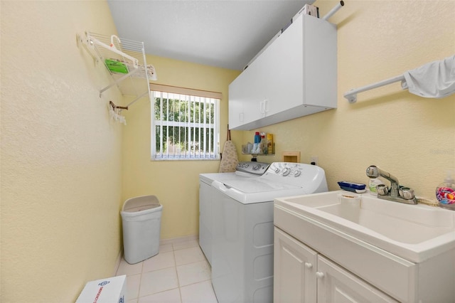 4461 La France Ave, North Port, FL 34286 - washroom with cabinet space, washing machine and dryer, and light tile patterned flooring