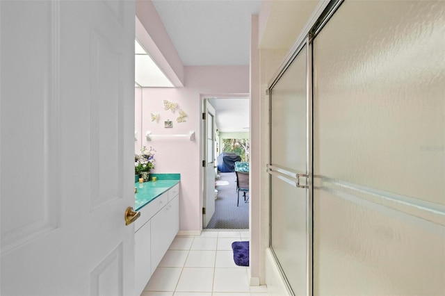 4461 La France Ave, North Port, FL 34286 - bathroom featuring a shower stall, tile patterned flooring, and vanity