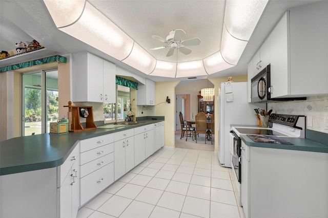 4461 La France Ave, North Port, FL 34286 - kitchen with dark countertops, a ceiling fan, black microwave, and electric stove