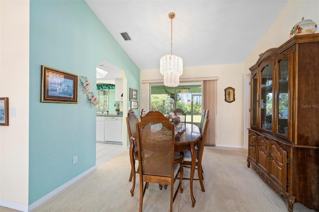 4461 La France Ave, North Port, FL 34286 - dining area with a chandelier, light carpet, baseboards, and high vaulted ceiling