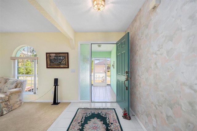 4461 La France Ave, North Port, FL 34286 - foyer entrance featuring baseboards, light tile patterned floors, and wallpapered walls