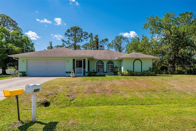 4461 La France Ave, North Port, FL 34286 - single story home featuring stucco siding, a garage, concrete driveway, and a front lawn