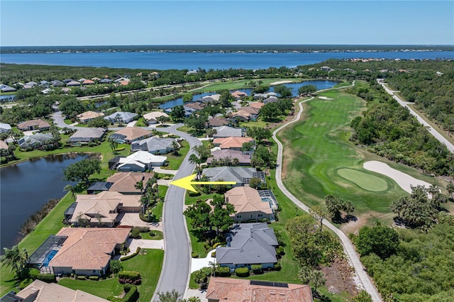 bird's eye view with golf course view, a residential view, and a water view
