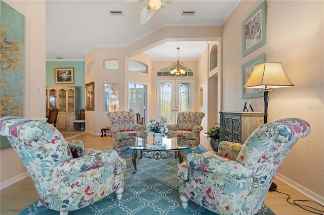 living area with ornamental molding, visible vents, and french doors