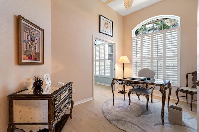 office featuring light wood-style floors and baseboards