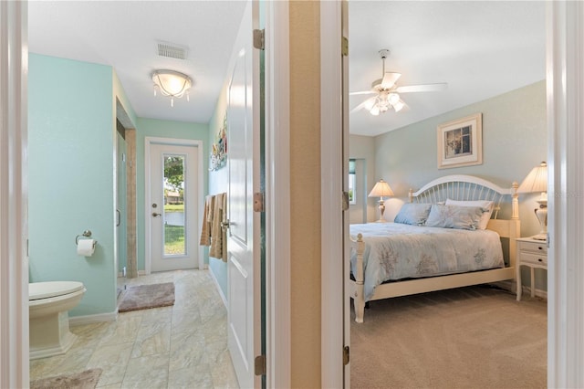 bedroom featuring access to exterior, visible vents, and baseboards
