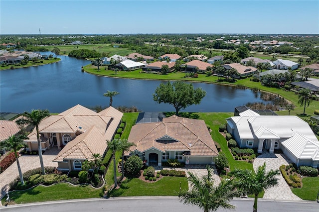 drone / aerial view with a residential view and a water view