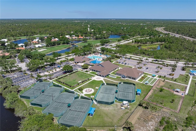 bird's eye view featuring a water view and a forest view