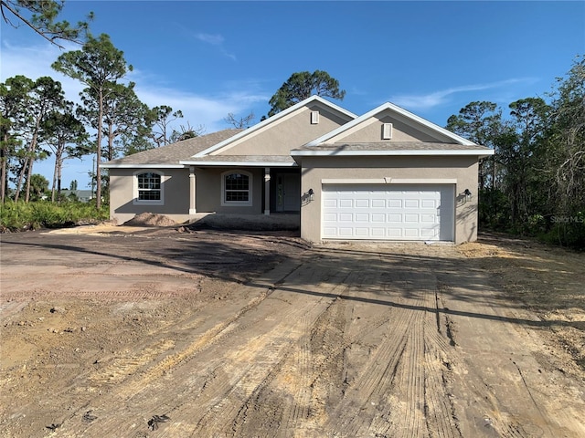 135 Hardee Way, Rotonda West, FL 33947 - single story home featuring driveway, stucco siding, and a garage