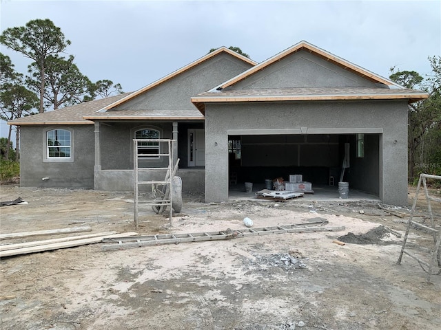 135 Hardee Way, Rotonda West, FL 33947 - property in mid-construction with stucco siding and a garage