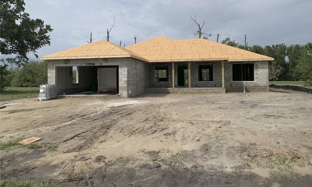 7 Pine Valley Ct, Rotonda West, FL 33947 - view of front facade featuring concrete block siding, a garage, and central AC