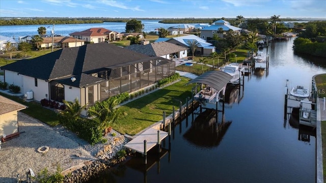 bird's eye view featuring a water view and a residential view