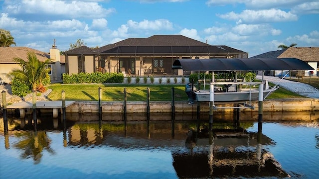 dock area featuring a lanai, boat lift, and a water view