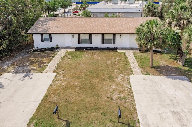 1665 Florence Ave Unit B, Englewood, FL 34223 - view of front of house with a front yard and stucco siding