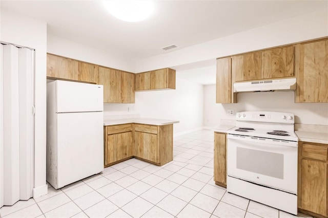 1665 Florence Ave Unit B, Englewood, FL 34223 - kitchen featuring white appliances, light tile patterned floors, light countertops, under cabinet range hood, and visible vents
