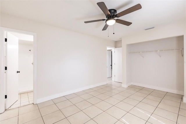1665 Florence Ave Unit B, Englewood, FL 34223 - unfurnished bedroom with a ceiling fan, a closet, light tile patterned floors, baseboards, and visible vents