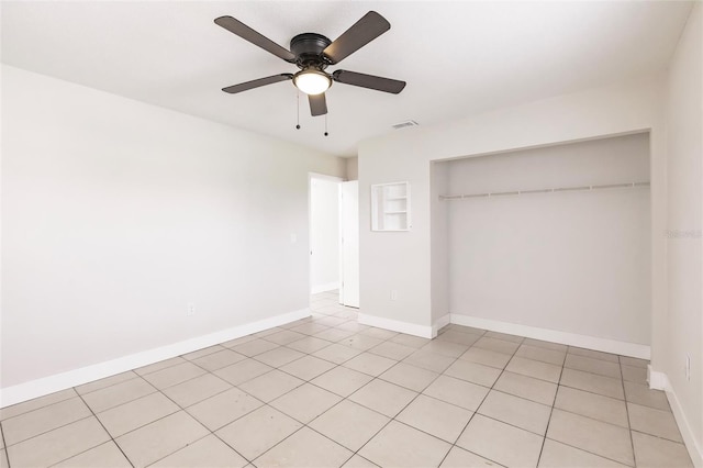 1665 Florence Ave Unit B, Englewood, FL 34223 - unfurnished bedroom featuring baseboards, visible vents, a closet, ceiling fan, and light tile patterned floors