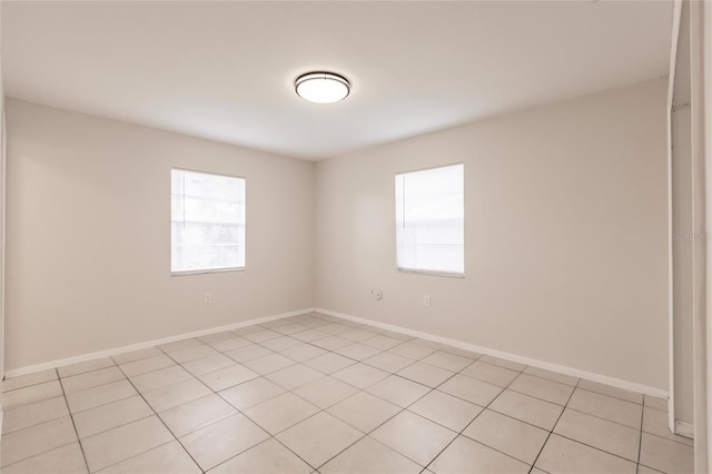 1665 Florence Ave Unit B, Englewood, FL 34223 - unfurnished room featuring baseboards and light tile patterned flooring