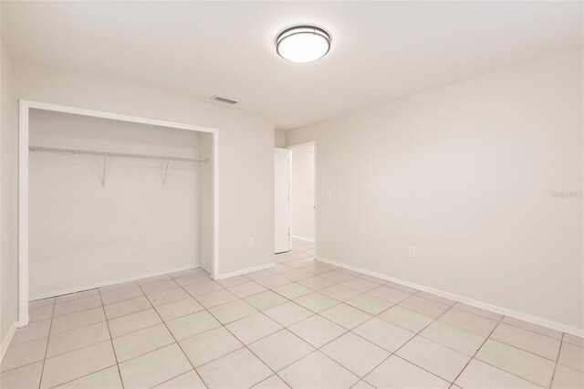 1665 Florence Ave Unit B, Englewood, FL 34223 - unfurnished bedroom featuring baseboards, visible vents, and a closet